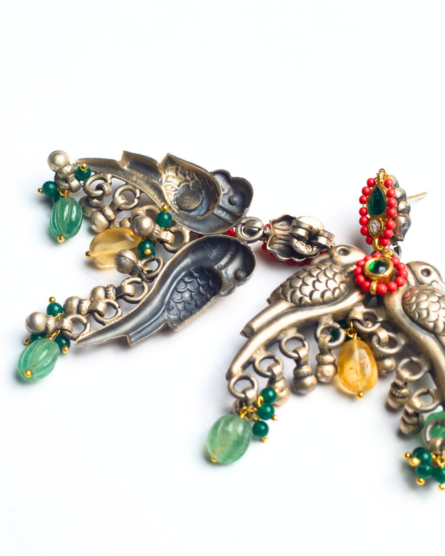 Back view of The Perched Parrots Earrings showing the sculpted reverse, structure, and fastening details in fusion silver jewellery.