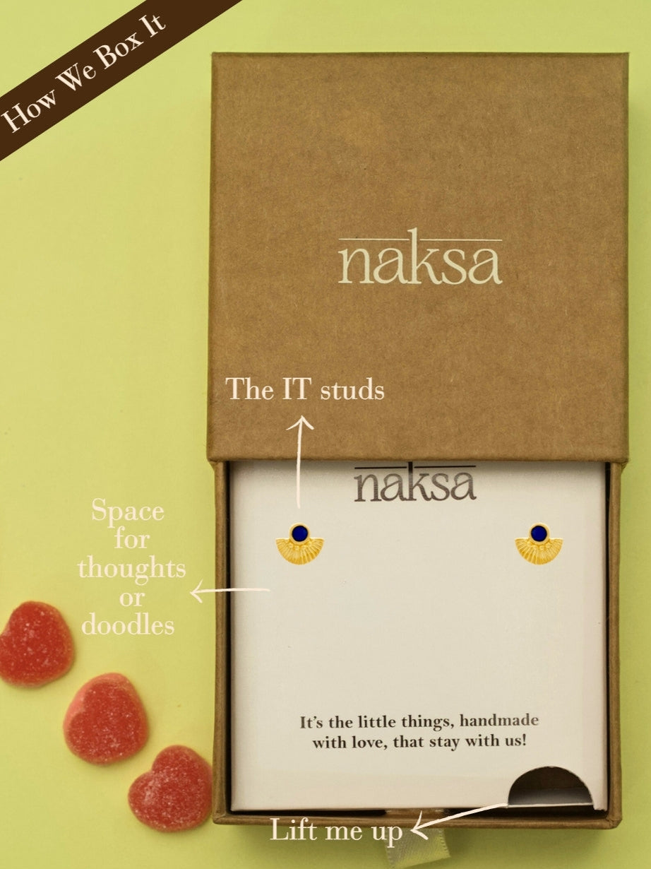 Cleosun Studs by Naksa—rising sun-inspired 925 silver earrings with cobalt blue enamel center and gold-polished fan rays.