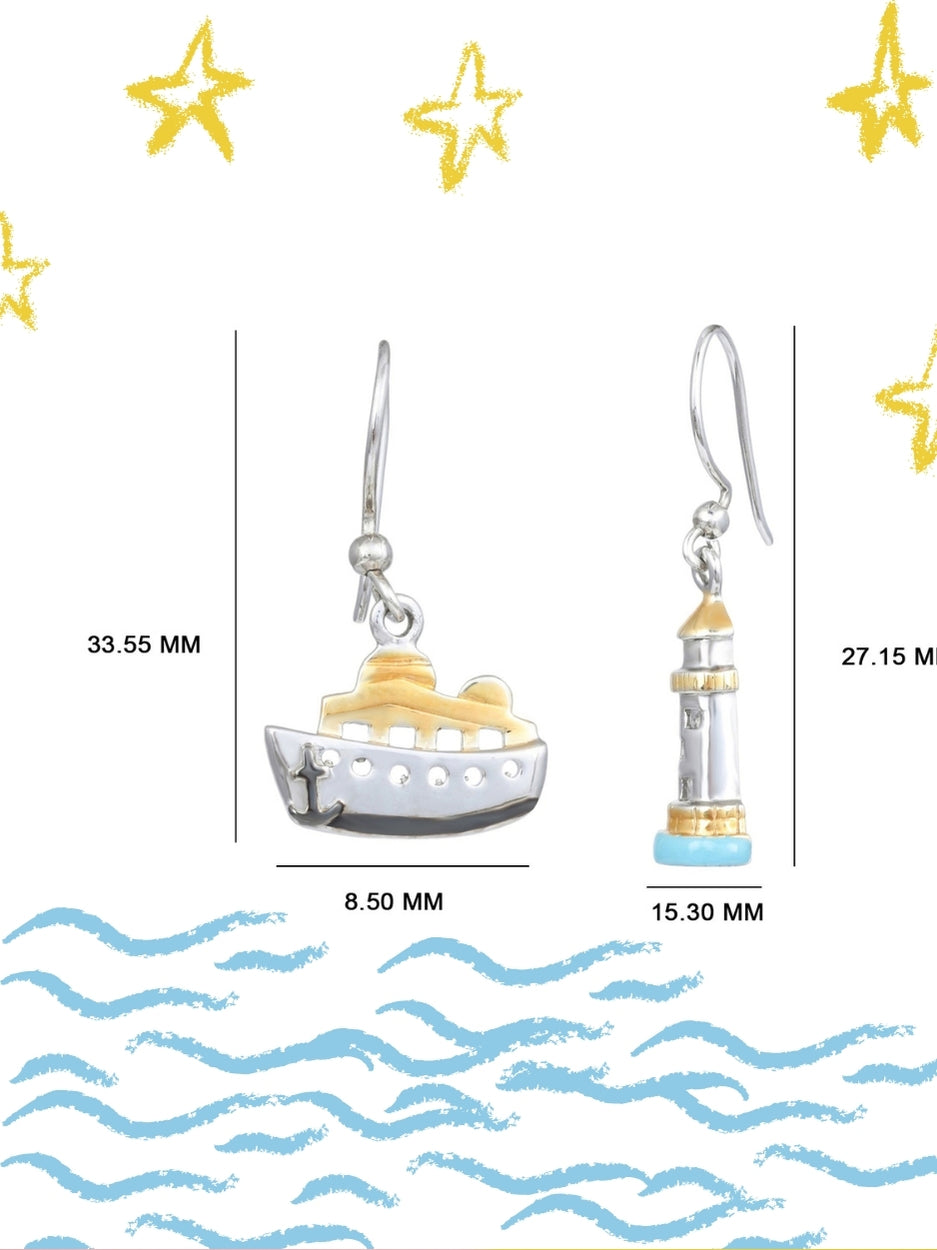 Sail & Stay Danglers by Naksa—mismatched nautical earrings featuring a ship and lighthouse in hand-enameled 925 silver with gold and blue accents.