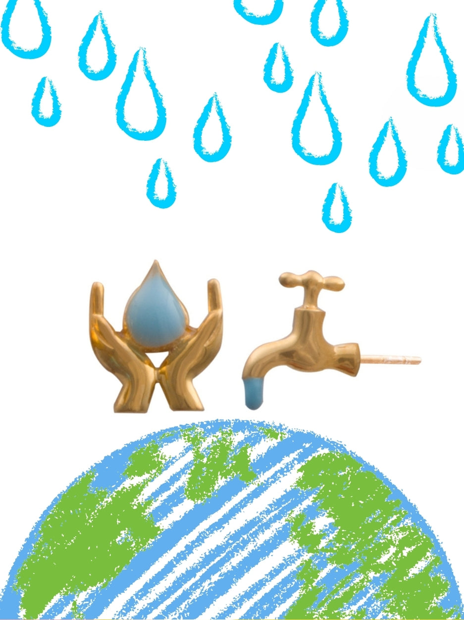 Save Water Studs by Naksaâmismatched earrings in 925 silver with a hand-holding-drop and dripping tap design in gold polish and blue enamel.