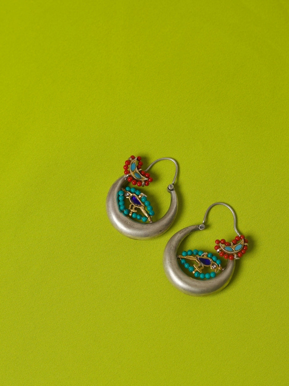Crescent-shaped 92.5 silver hoop earrings with red and turquoise beads and a hand-painted enamel parrot