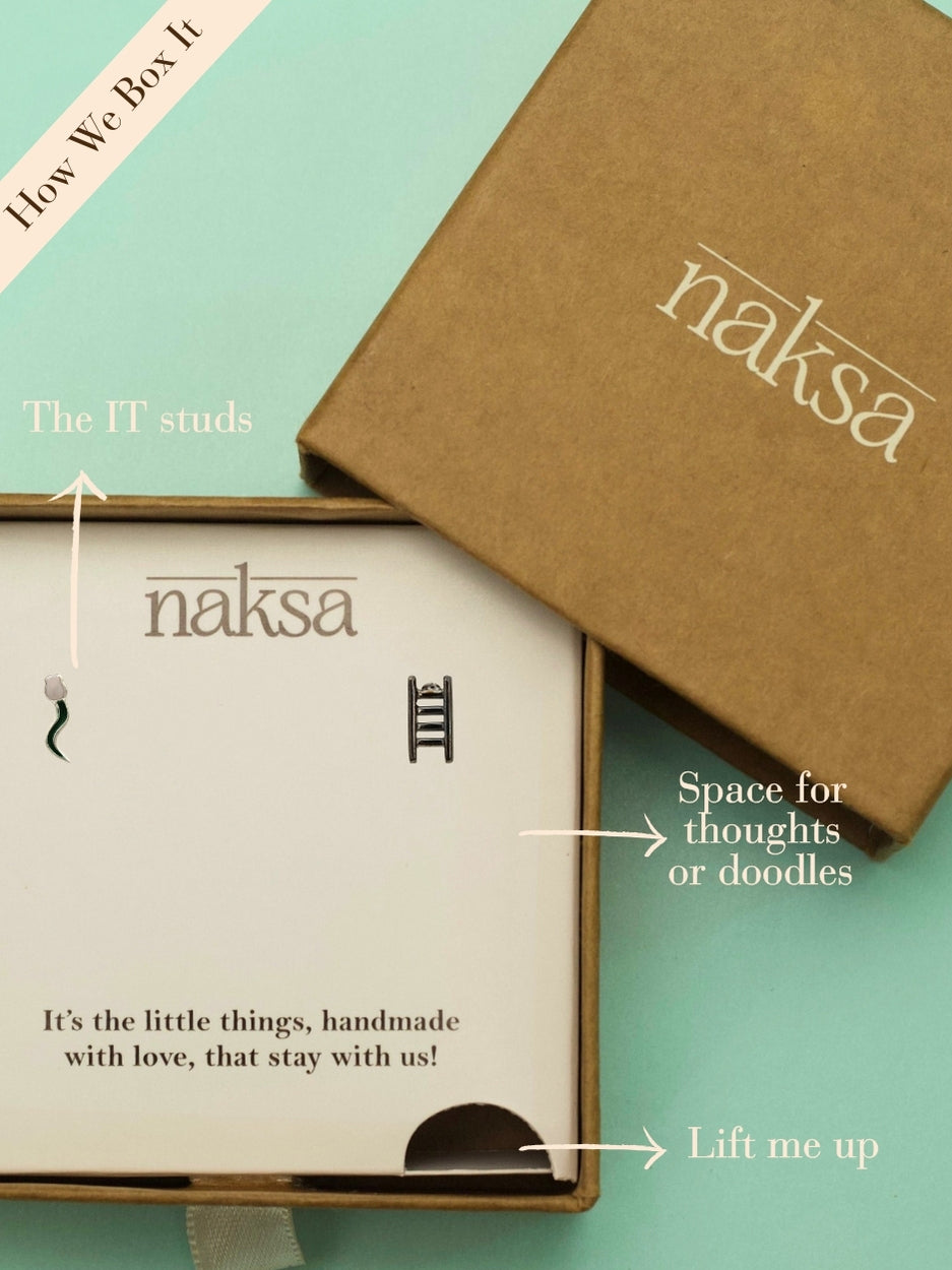 Game On Studs by Naksa—mismatched 92.5 silver earrings featuring snake and ladder motifs, handcrafted for playful, nostalgic gifting.
