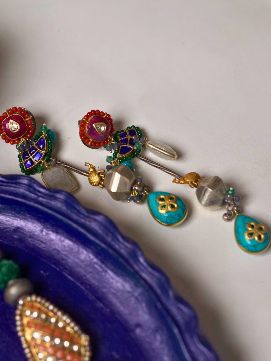 Long 92.5 silver fusion earrings with kundan red tops, faceted beads, turquoise floral drops, and handcrafted multicolor details
