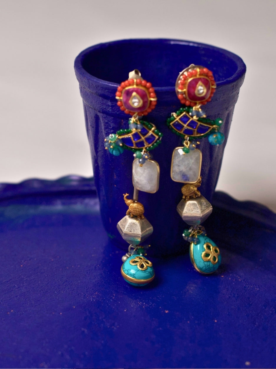 Long 92.5 silver fusion earrings with kundan red tops, faceted beads, turquoise floral drops, and handcrafted multicolor details