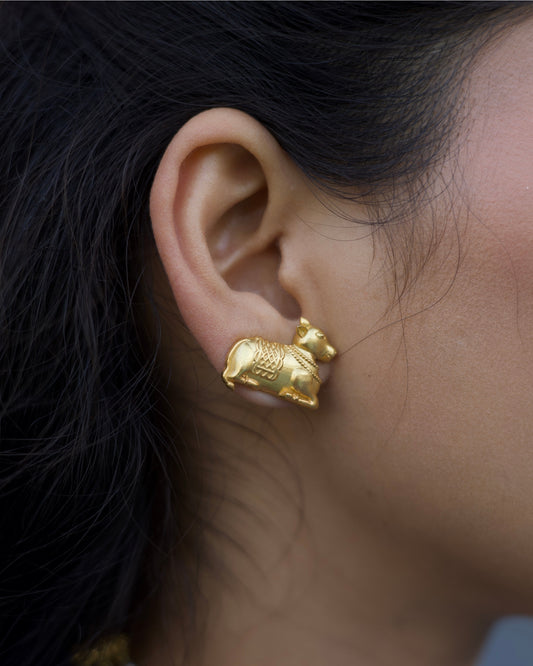 925 silver gold-polished Nandi bull motif stud earrings with detailed carving and temple-inspired design
