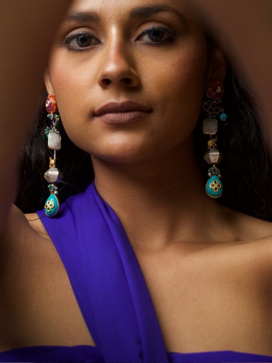 Long 92.5 silver fusion earrings with kundan red tops, faceted beads, turquoise floral drops, and handcrafted multicolor details