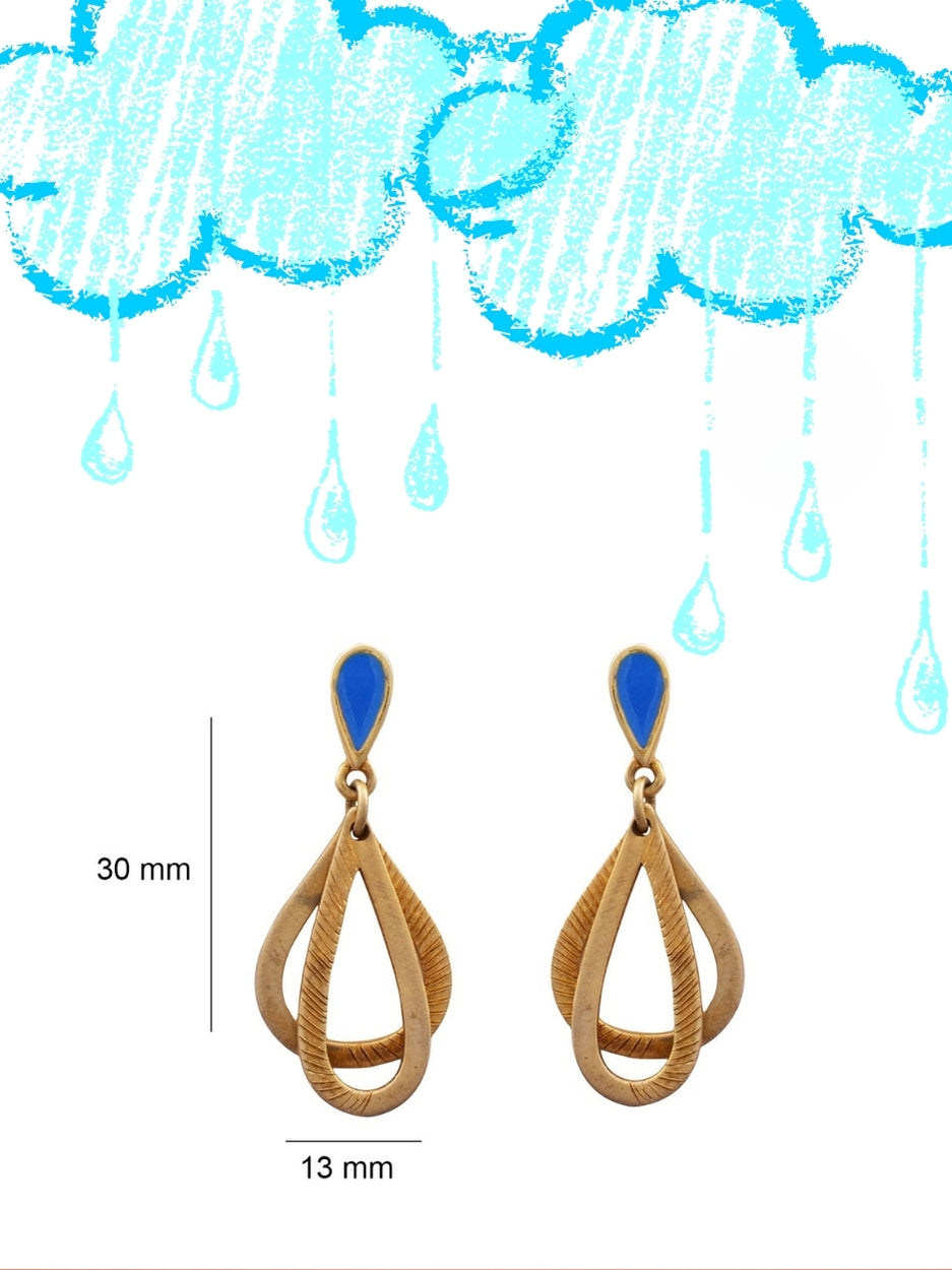 Drop Everything Studs by Naksa—layered raindrop-style 925 silver danglers with matte gold finish and blue enamel top, inspired by monsoon drama.