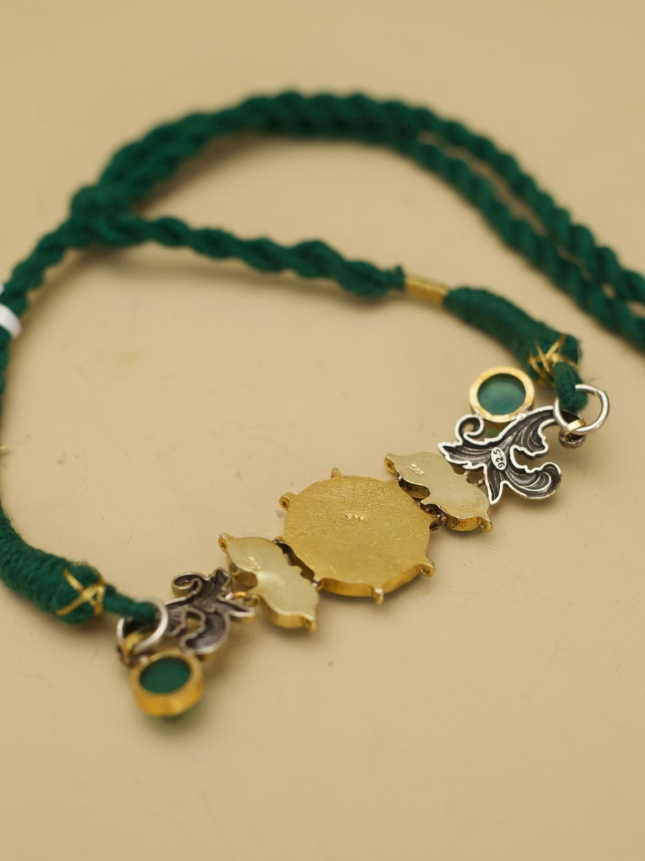 Fusion-style green kundan choker in pure 925 silver with parrot motifs and textured two-tone elements by Naksa.