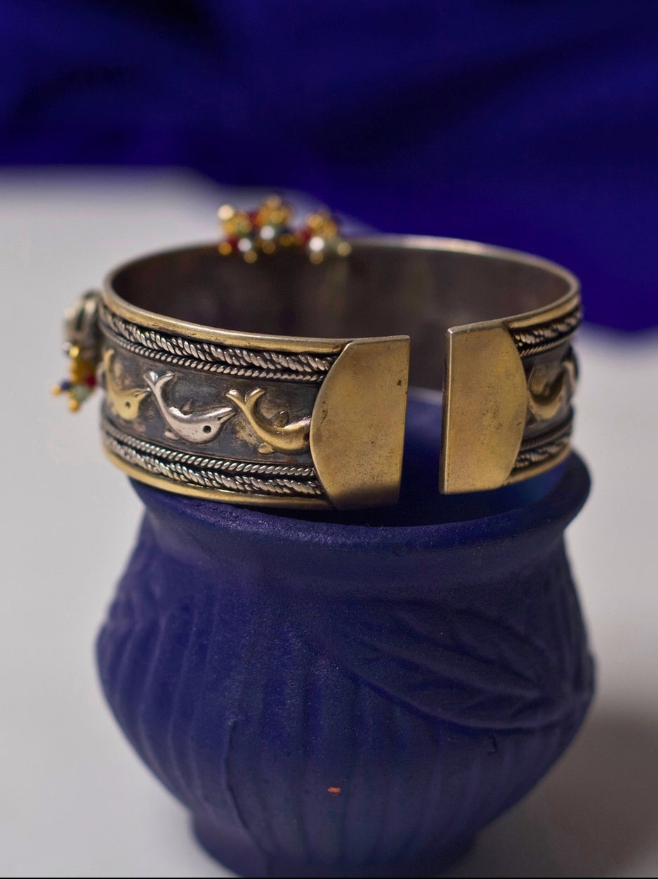 92.5 silver cuff bracelet with floral carving, kundan accents, heritage motifs, and gold-silver dual tone from Naksa’s fusion collection