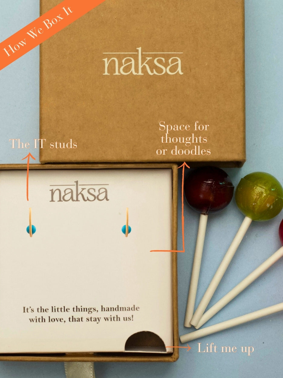 Crown Curve Studs by Naksaāblue enamel and gold-polished 925 silver earrings with a sculptural curved hoop design.