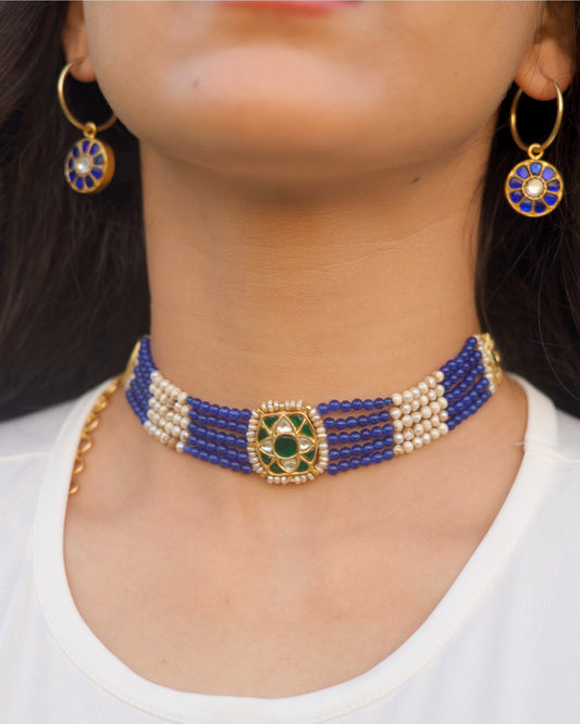 Blue and pearl striped choker in 925 silver with gold polish and kundan-set green centre stone by Naksa