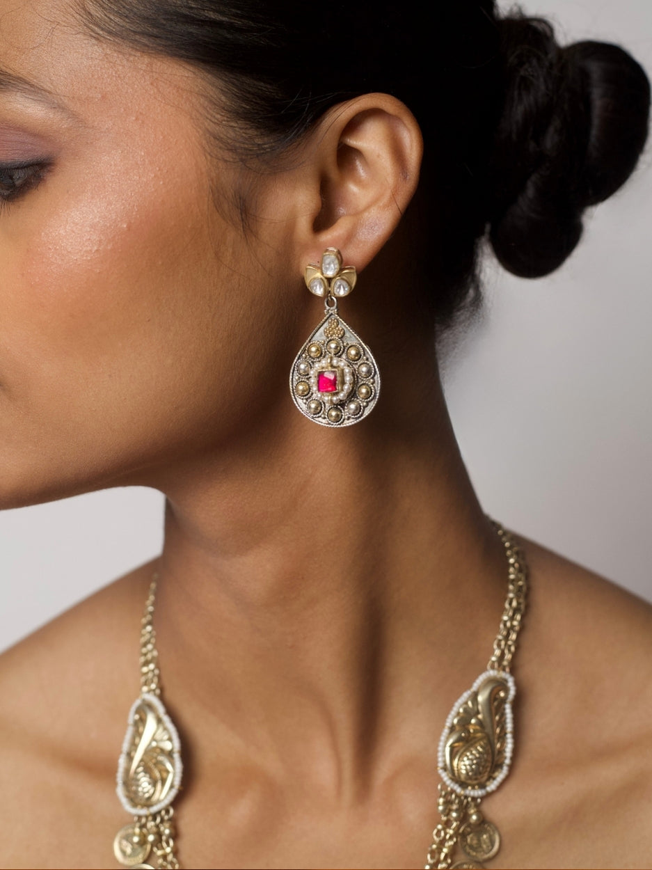 Sikka-inspired gold-silver necklace set with coin chain, floral accents, temple dome pendant, and matching kundan earrings.
