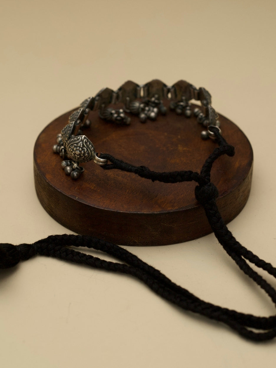 Purna Kalash Choker by Naksa—oxidized 925 silver choker with kalash motifs and ghungroo danglers, inspired by Indian temple iconography.