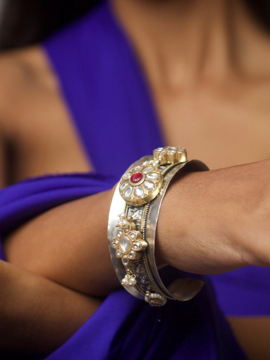 Close-up of Mirror of the Maharani Bracelet in pure 92.5 silver with kundan-style floral motifs, gold accents, and intricate detailing.