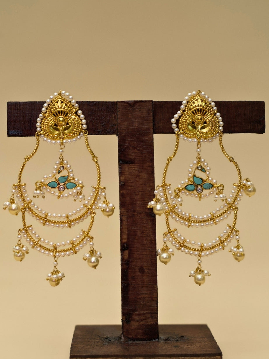 Tyohaar Jhumkas by Naksa—925 silver earrings with gold polish, layered pearl chains, kundan floral drops, and festive bell charms.