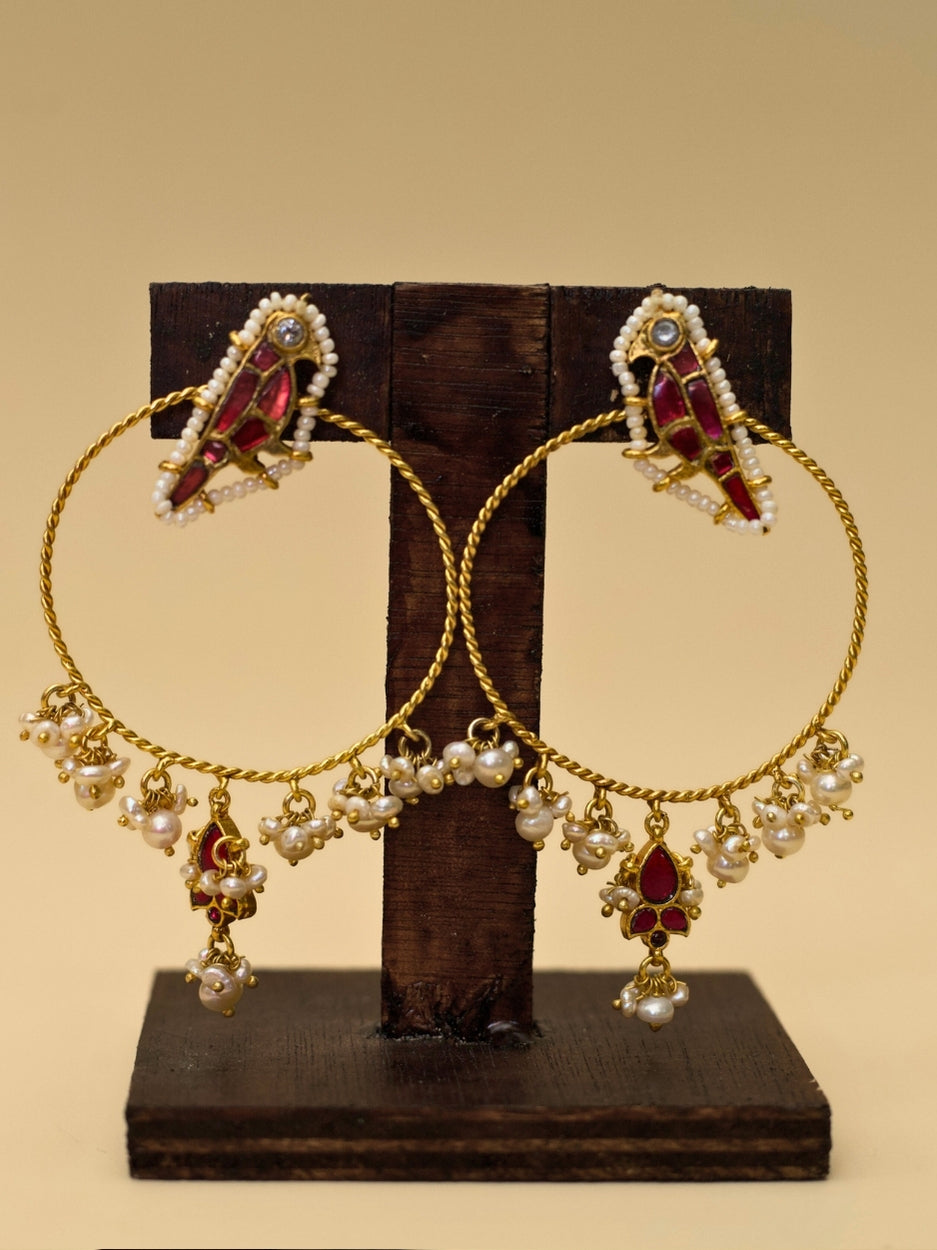 Jhoom Jhumkas by Naksa—gold polished 925 silver hoop earrings with red kundan drops, pearl fringe, and twisted wire design.