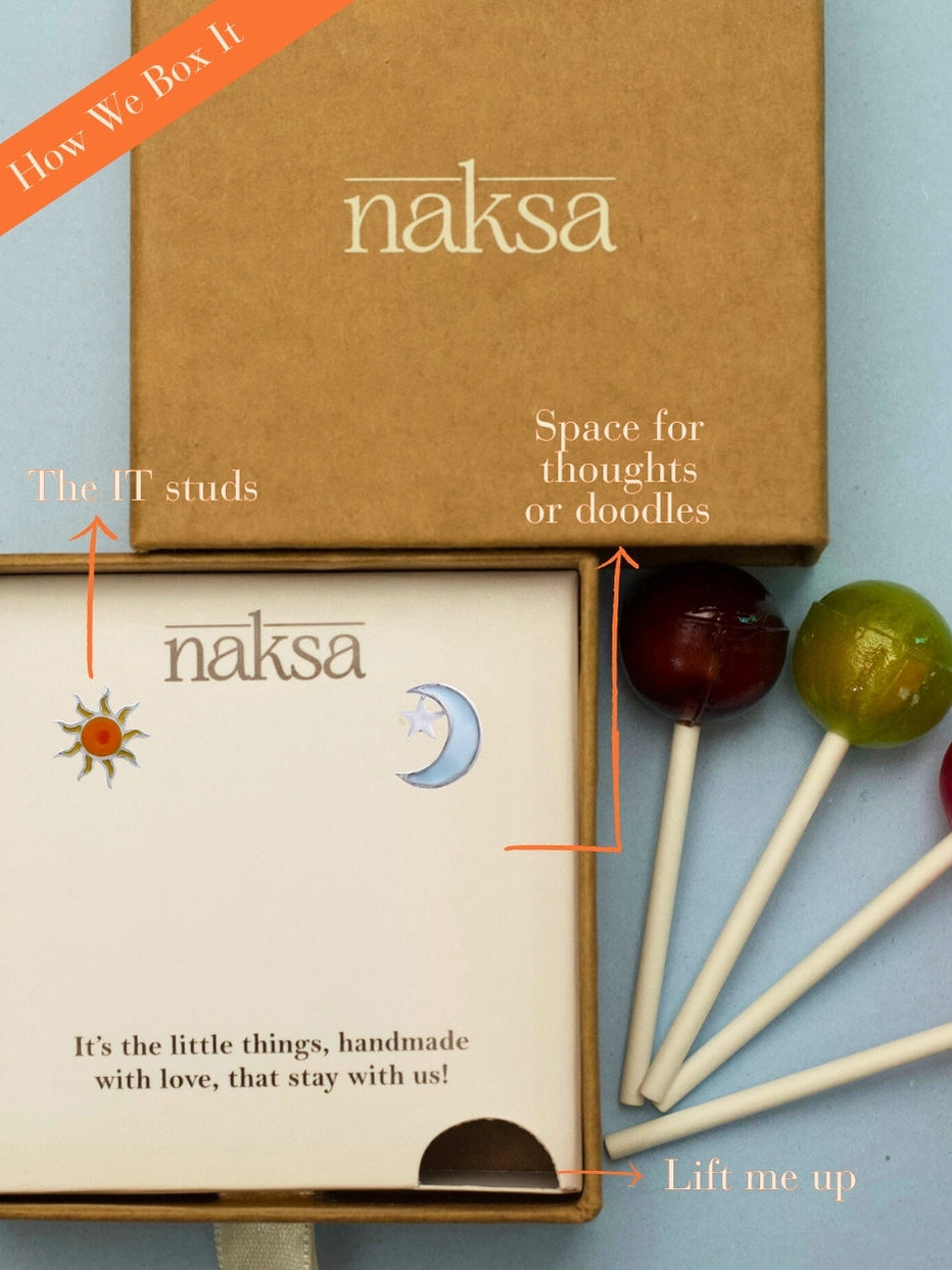 AM to PM Studs by Naksa—sun and moon mismatched enamel earrings crafted in pure 925 silver with pastel detailing.