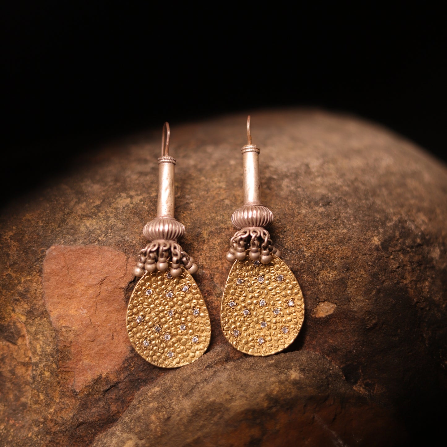 Antique beaded danglers inspired by the mythical Gadaa, paired with a 925 gold-polished textured silver plate, combining historical mystique with contemporary design.