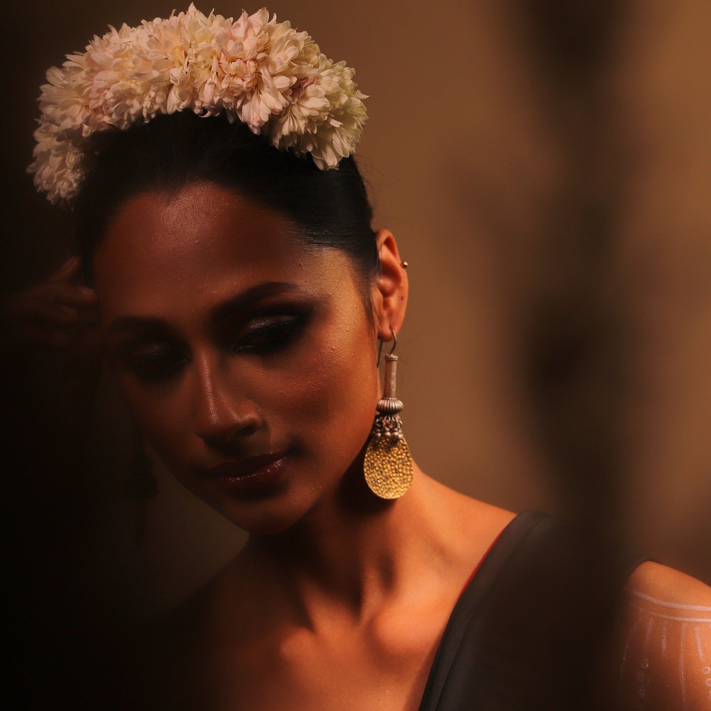 Antique beaded danglers inspired by the mythical Gadaa, paired with a 925 gold-polished textured silver plate, combining historical mystique with contemporary design.