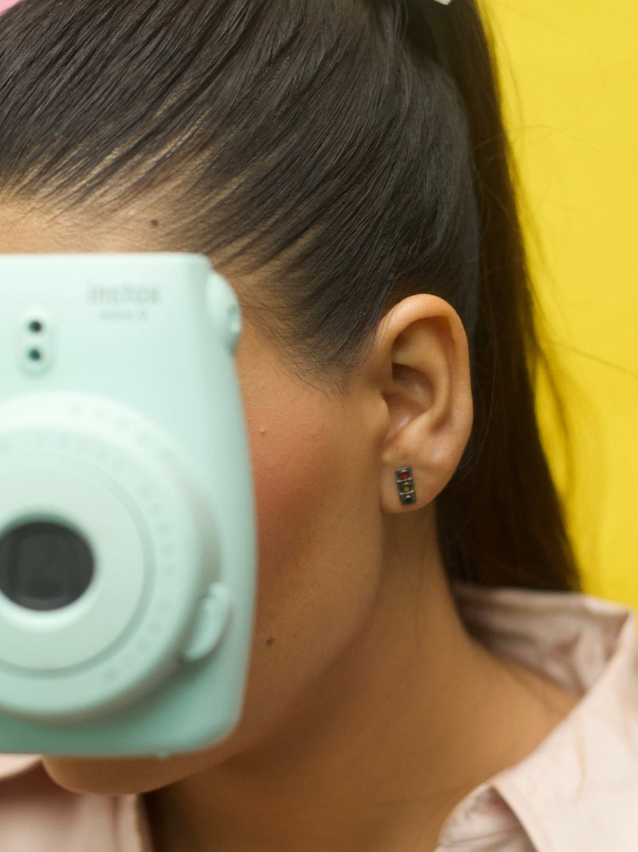 Horn OK Studs by Naksaâtraffic signal earrings in red, yellow, and green enamel crafted in pure 925 silver with oxidized detailing.