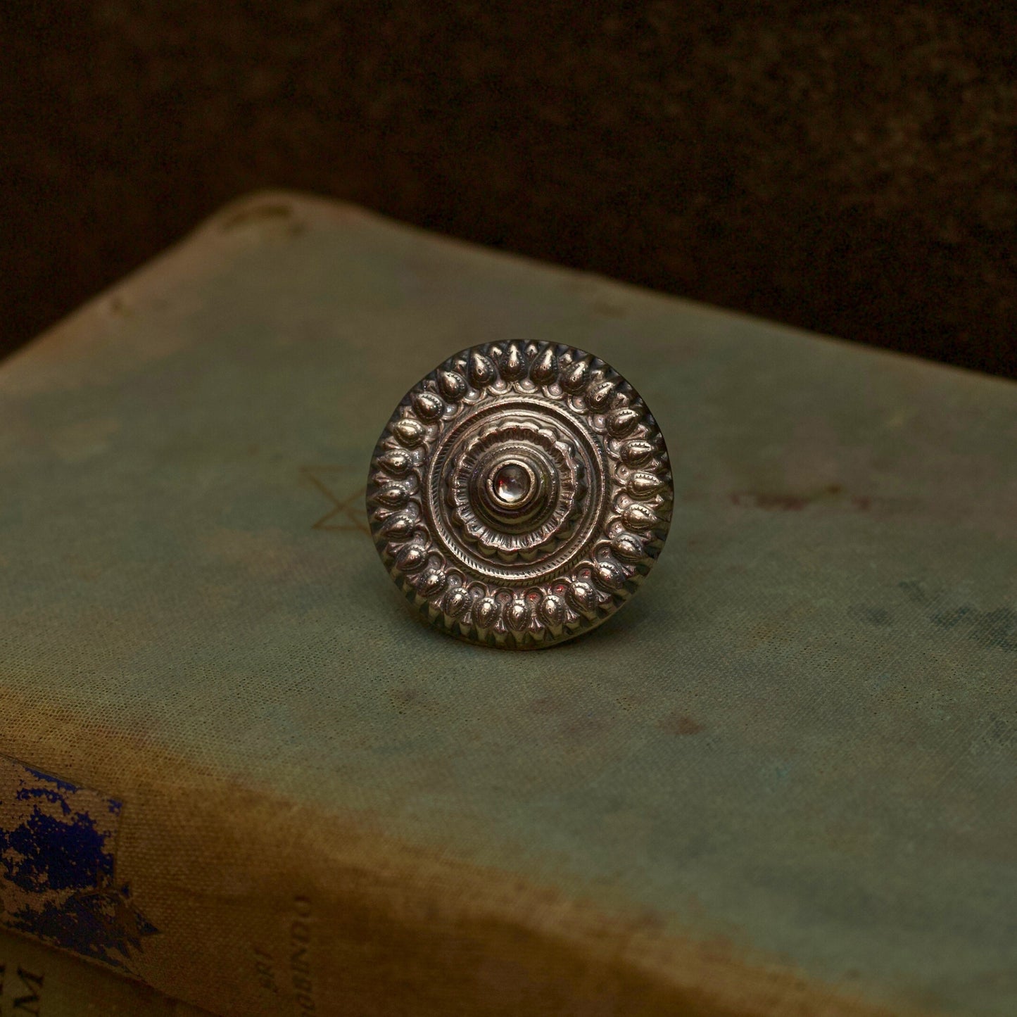 Literature and jewellery have the power to alter lives. Express your unyielding spirit with our pure oxidised silver ring with a spiral engraved pattern symbolising the ripples of hope in stagnant waters. It has an adjustable pure silver band for the perfect fit which makes it an ideal everyday wear jewellery.