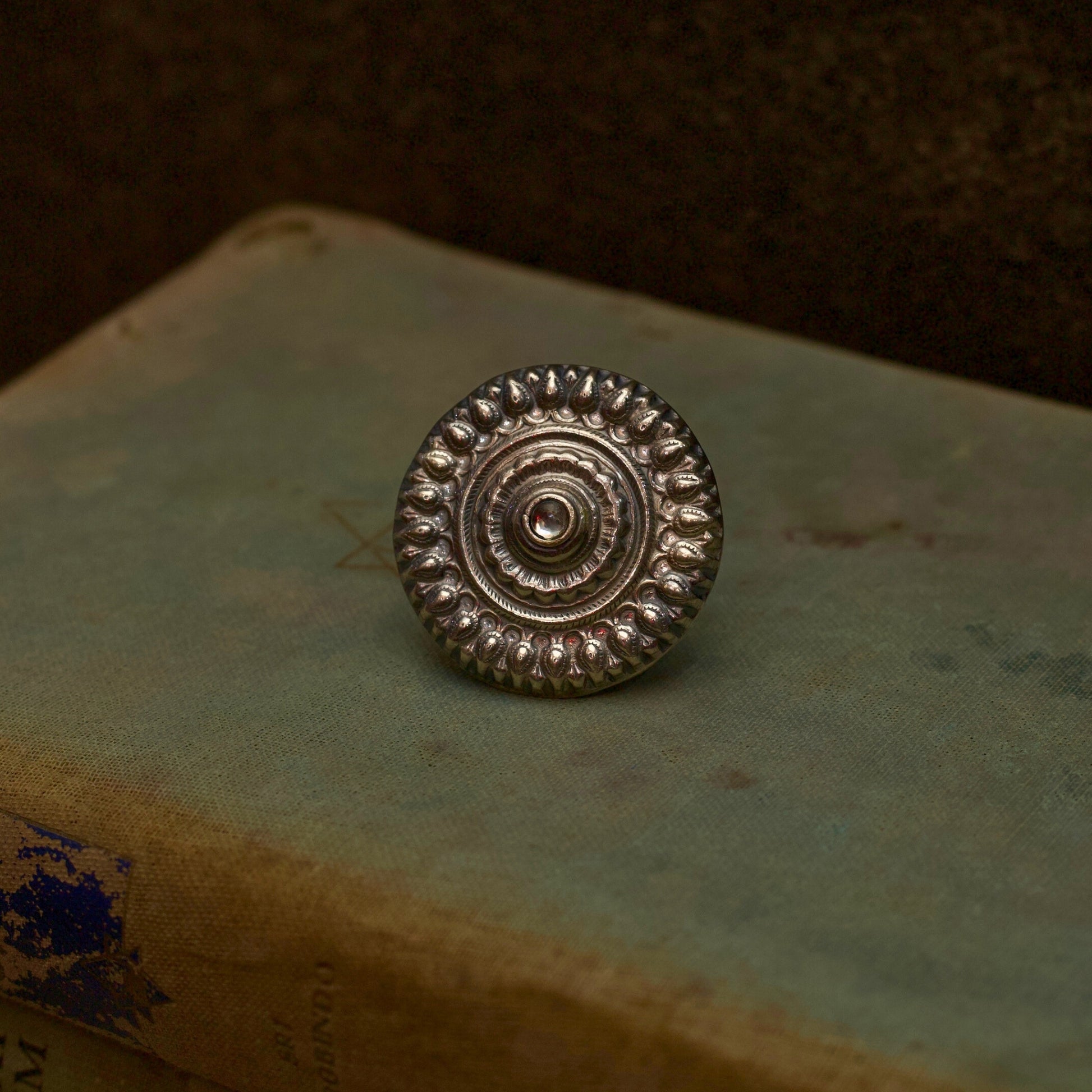 Literature and jewellery have the power to alter lives. Express your unyielding spirit with our pure oxidised silver ring with a spiral engraved pattern symbolising the ripples of hope in stagnant waters. It has an adjustable pure silver band for the perfect fit which makes it an ideal everyday wear jewellery.