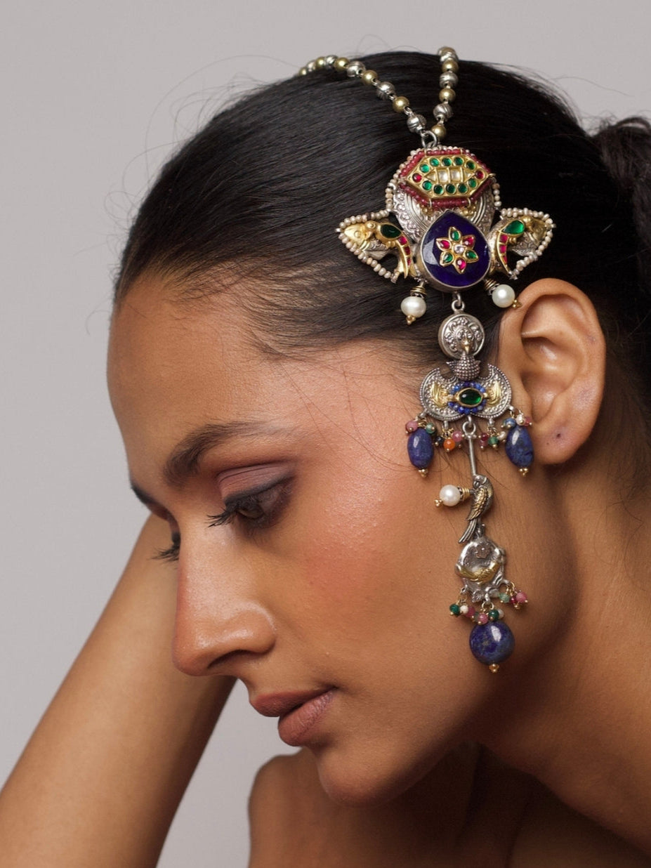 925 silver necklace with elephant heads, abstract Ganesha figure, fish motif, enamel detailing, and gold accents, worn on model’s head.