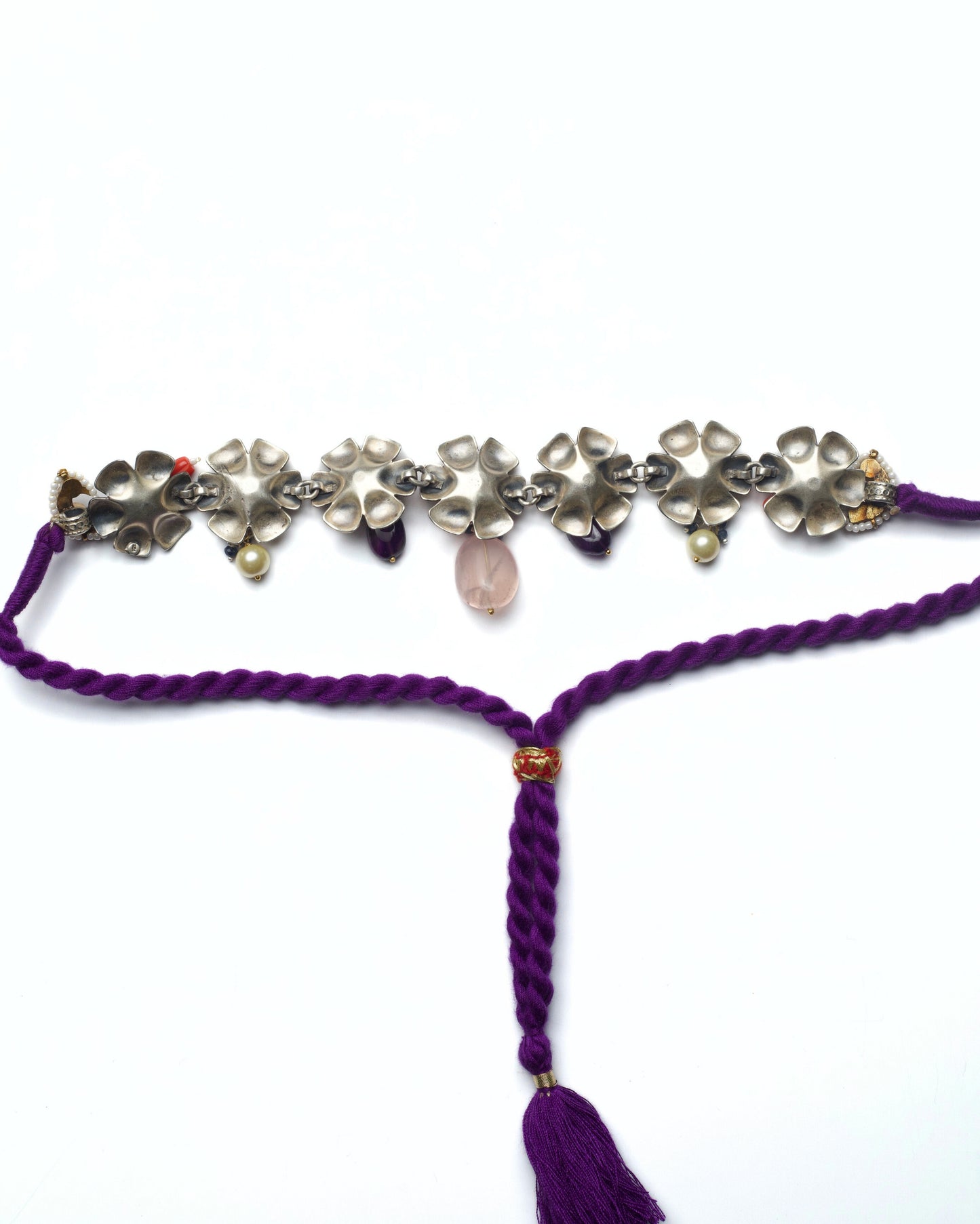 Back of handcrafted silver flower motifs with kundan detailing and blush pink gemstone drops