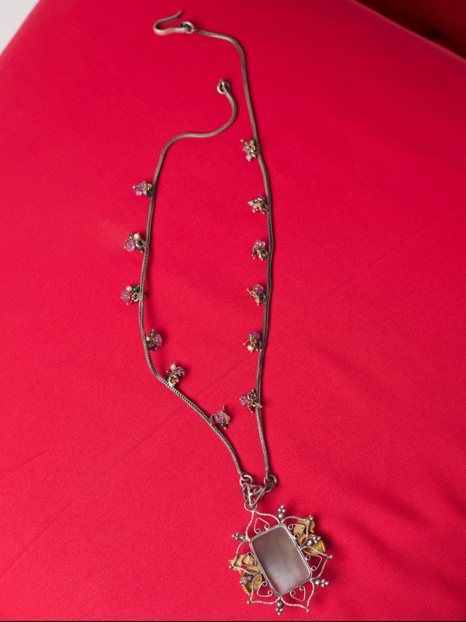 Pure silver necklace with carved salmon gemstone, kundan navratna detailing, gold parrots and bead accents
