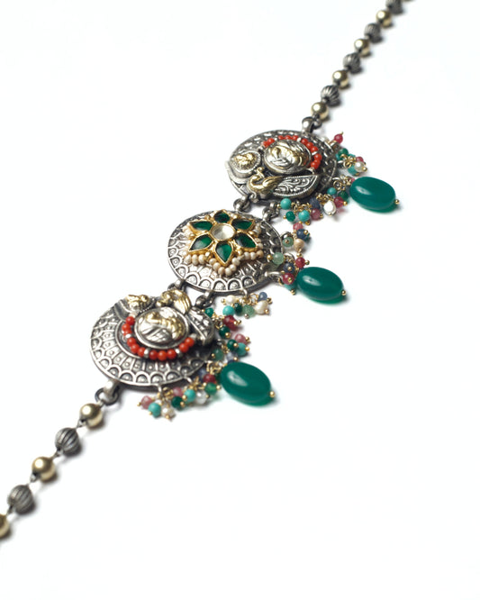 Close-up of engraved silver panel with bead detailing on three-panel silver choker