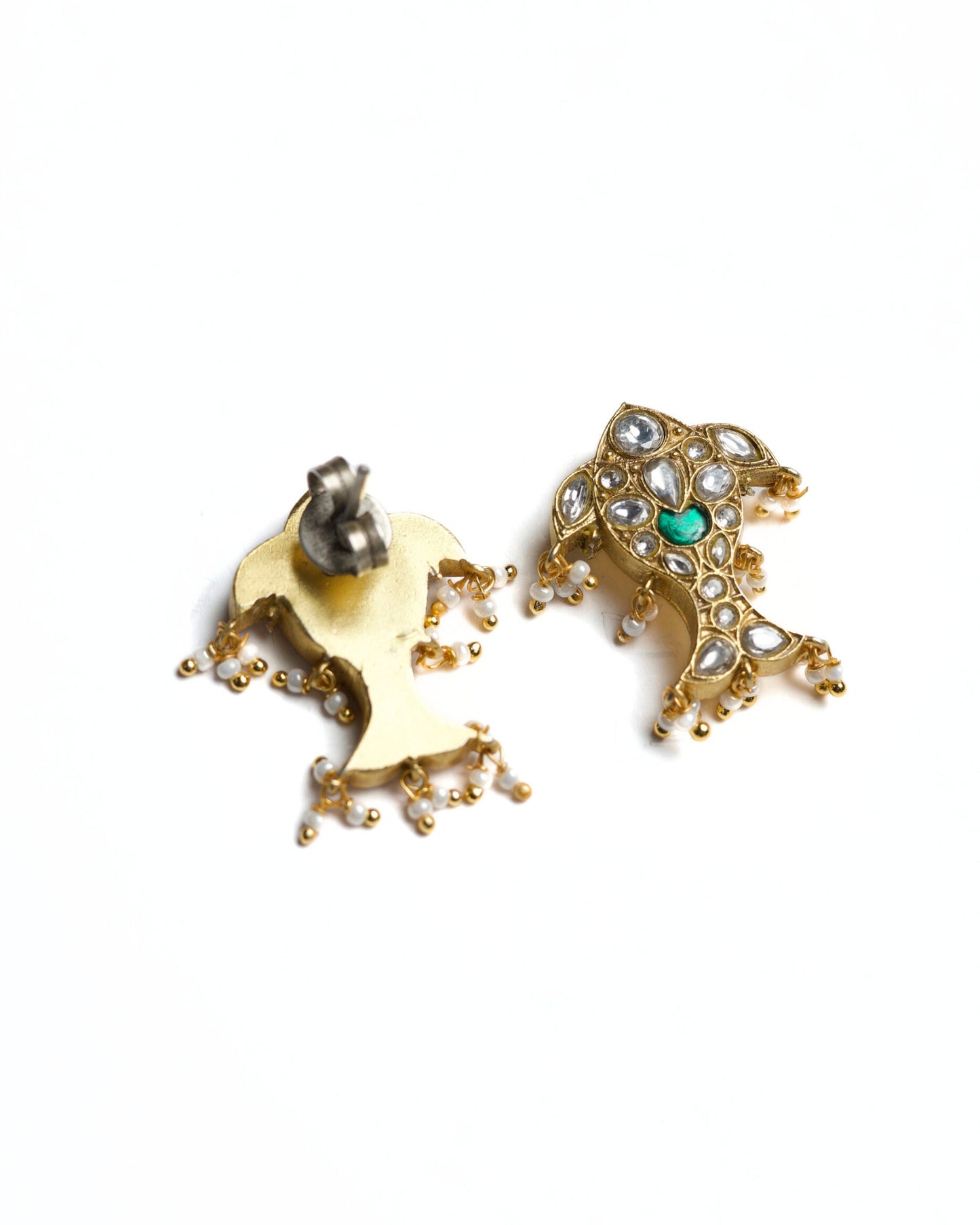 Close-up of fish motif earrings with pearl drops and kundan detailing
