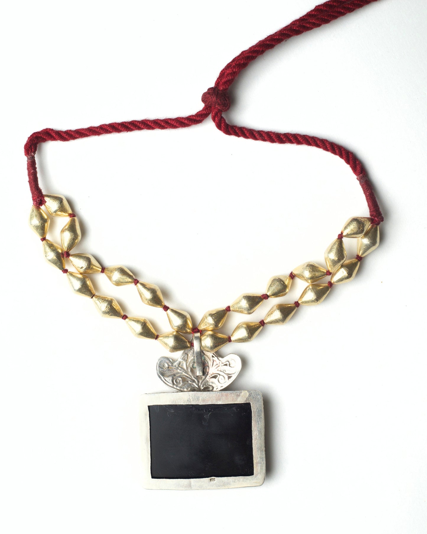 Back of Black Loom Choker with golden wax beads and handworked black chitai centre