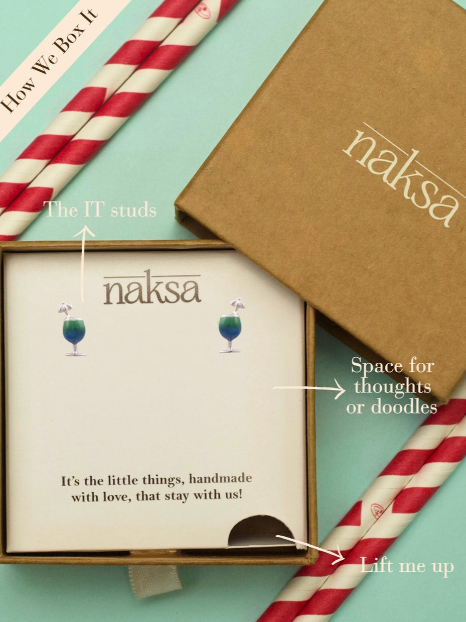 Sip Sip Hooray Studs by Naksa—cocktail glass earrings hand-enameled in green and blue with silver umbrella, crafted in pure 925 silver.