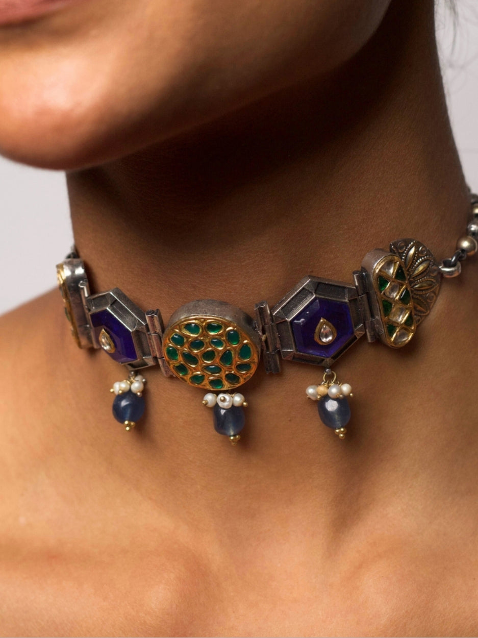 92.5 silver choker necklace with geometric blue enamel, green kundan motifs, and pearl-tipped blue drops; fusion statement jewelry from Naksa.