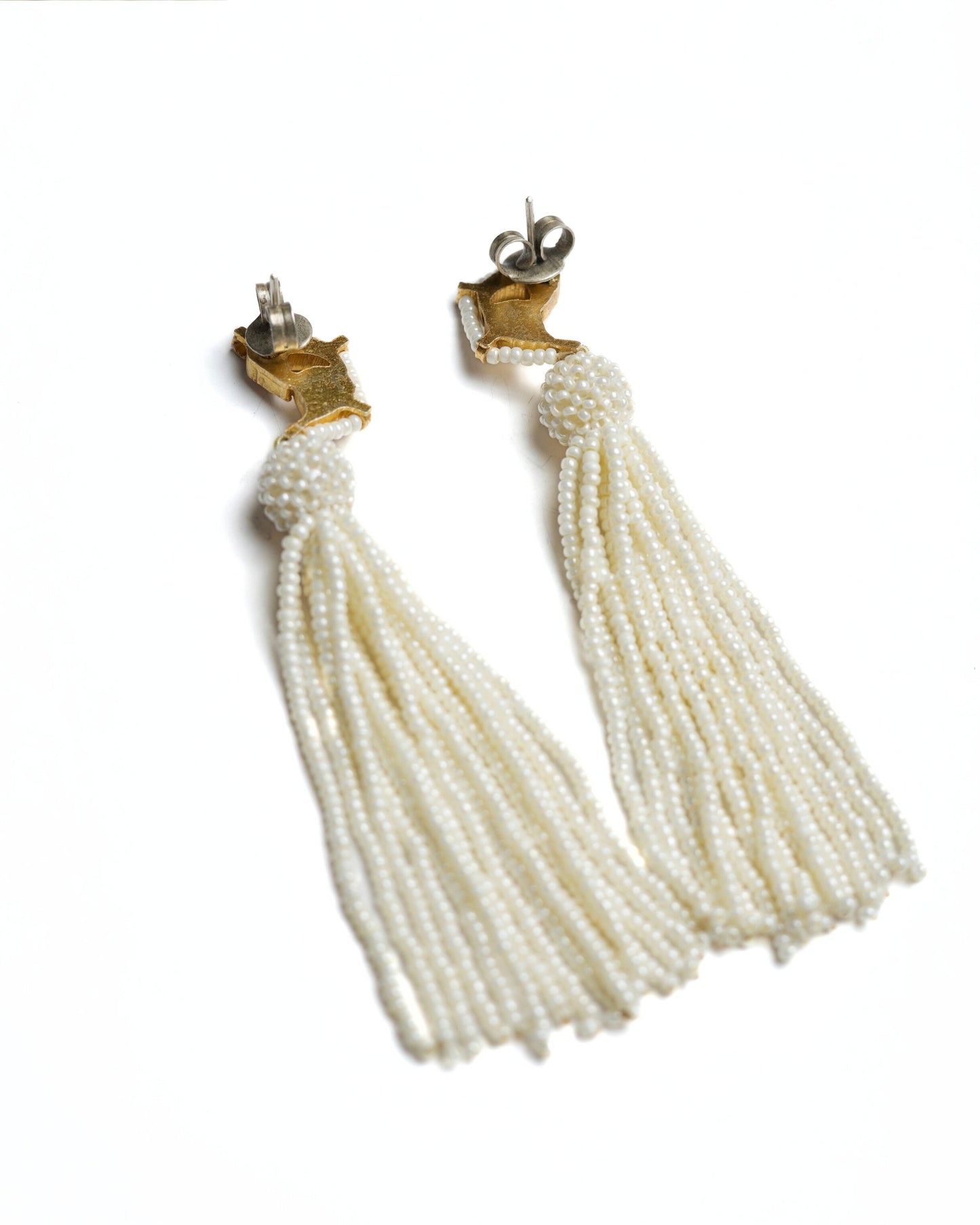 Gold-toned 925 silver bird earrings with kundan-style stones and long cascading pearl tassels.