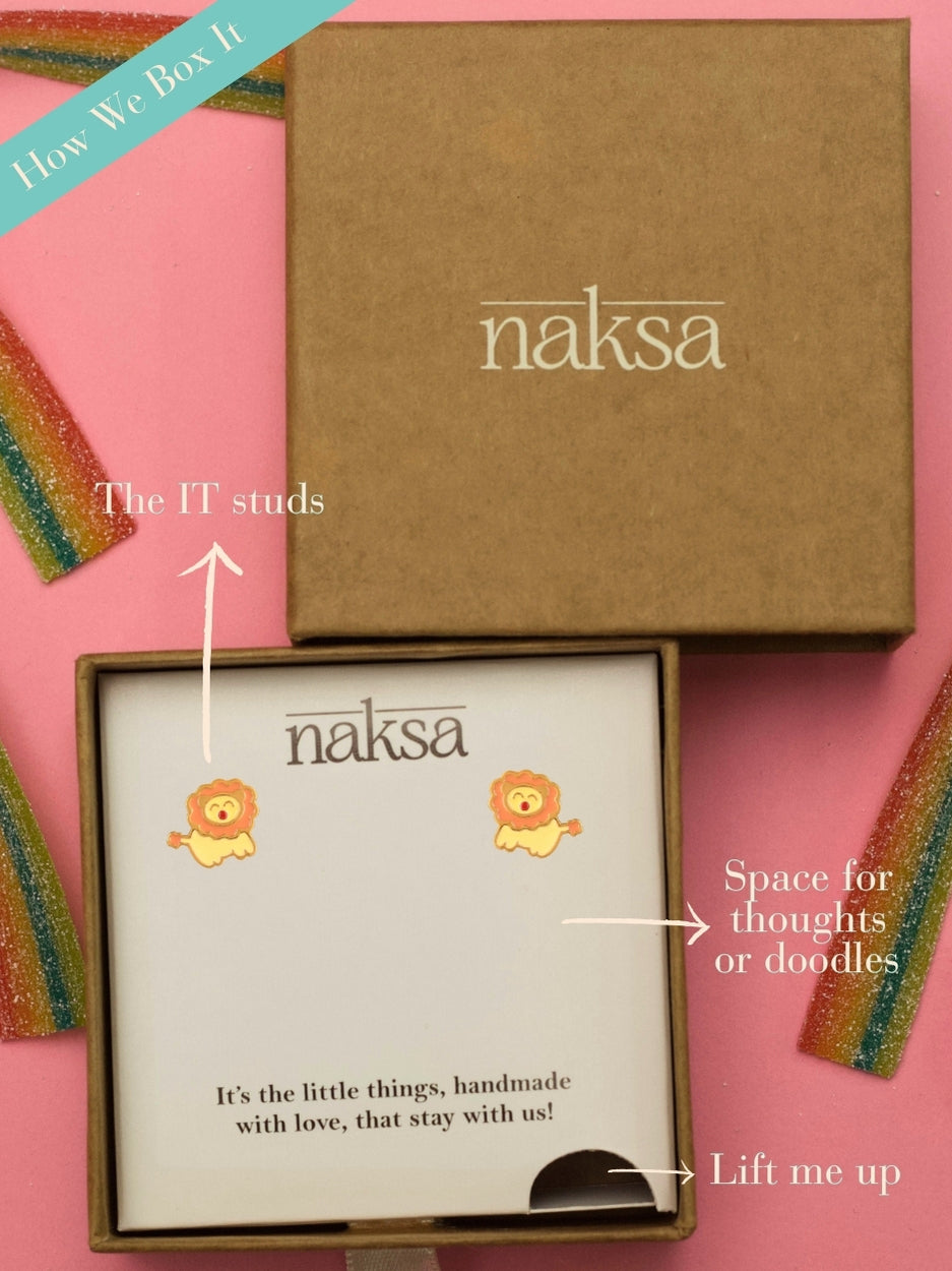 La La Lion Studs by Naksaālion-shaped enamel earrings in gold-polished 925 silver, handcrafted with soft orange and yellow accents.