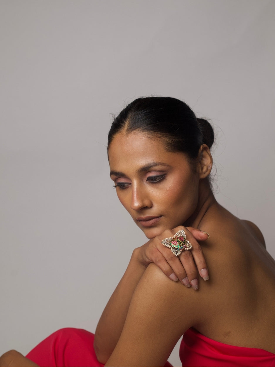 Butterfly-shaped fusion ring in 92.5 silver with meenakari enamel work, pearl edges, and multicolored bead tassels