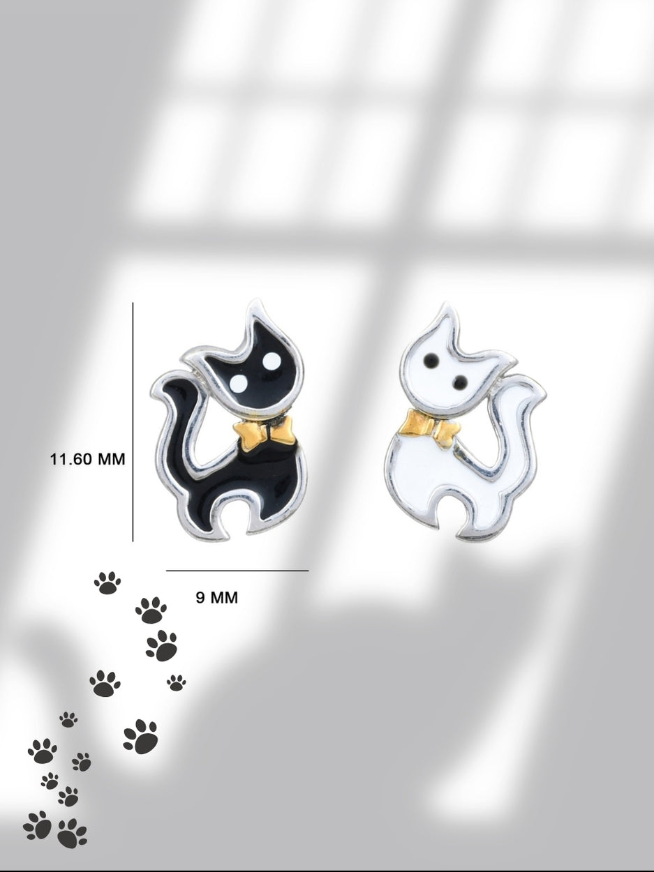 Mismatched Meows Studs by Naksa—black and white tuxedo cat earrings with golden bows, hand-enameled in pure 925 silver.