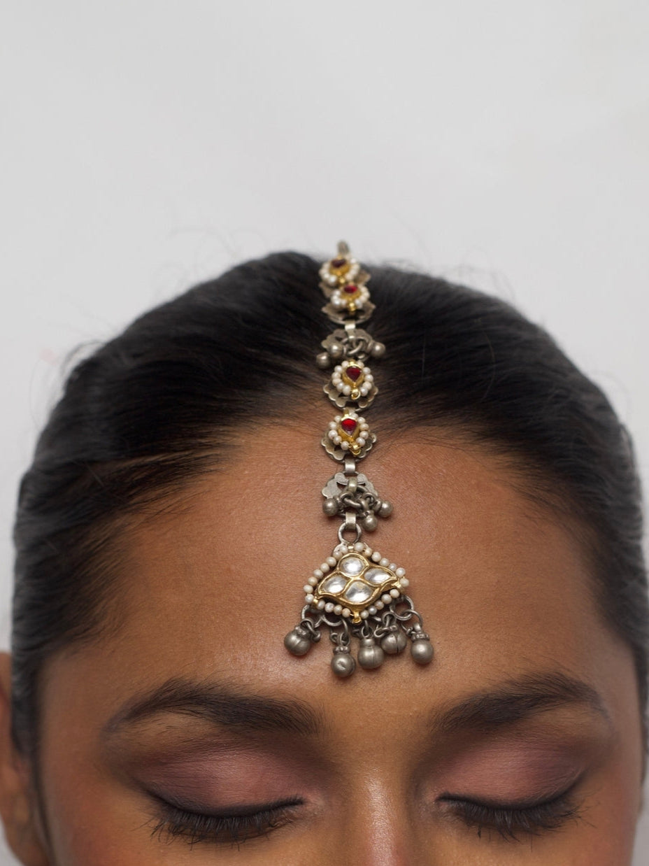 92.5 silver maang tikka featuring red floral elements, kundan stones, seed pearls, and ghungroos – handcrafted Indian hair accessory