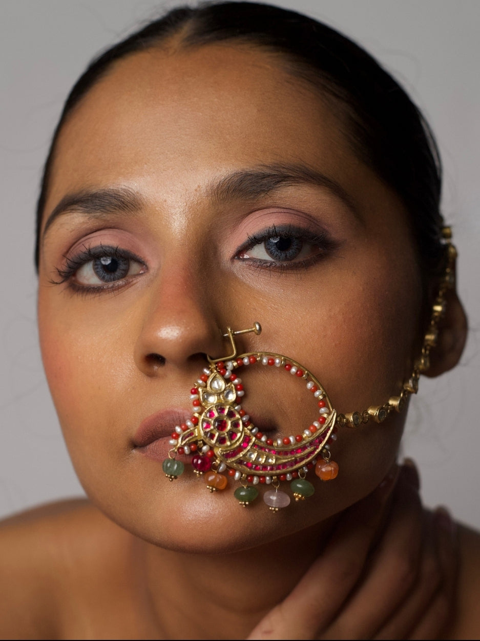Model wearing The Rasa Nath – 92.5 silver gold-plated non-pierced nath with enamel, pearls, and colorful gemstone drops