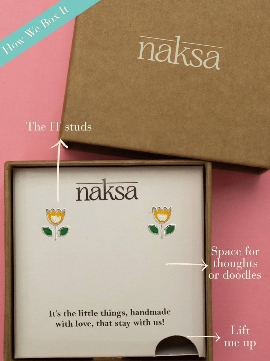 You Grow Girl Studs by Naksa—yellow tulip-shaped 925 silver earrings with green leaves and glitter heart center.