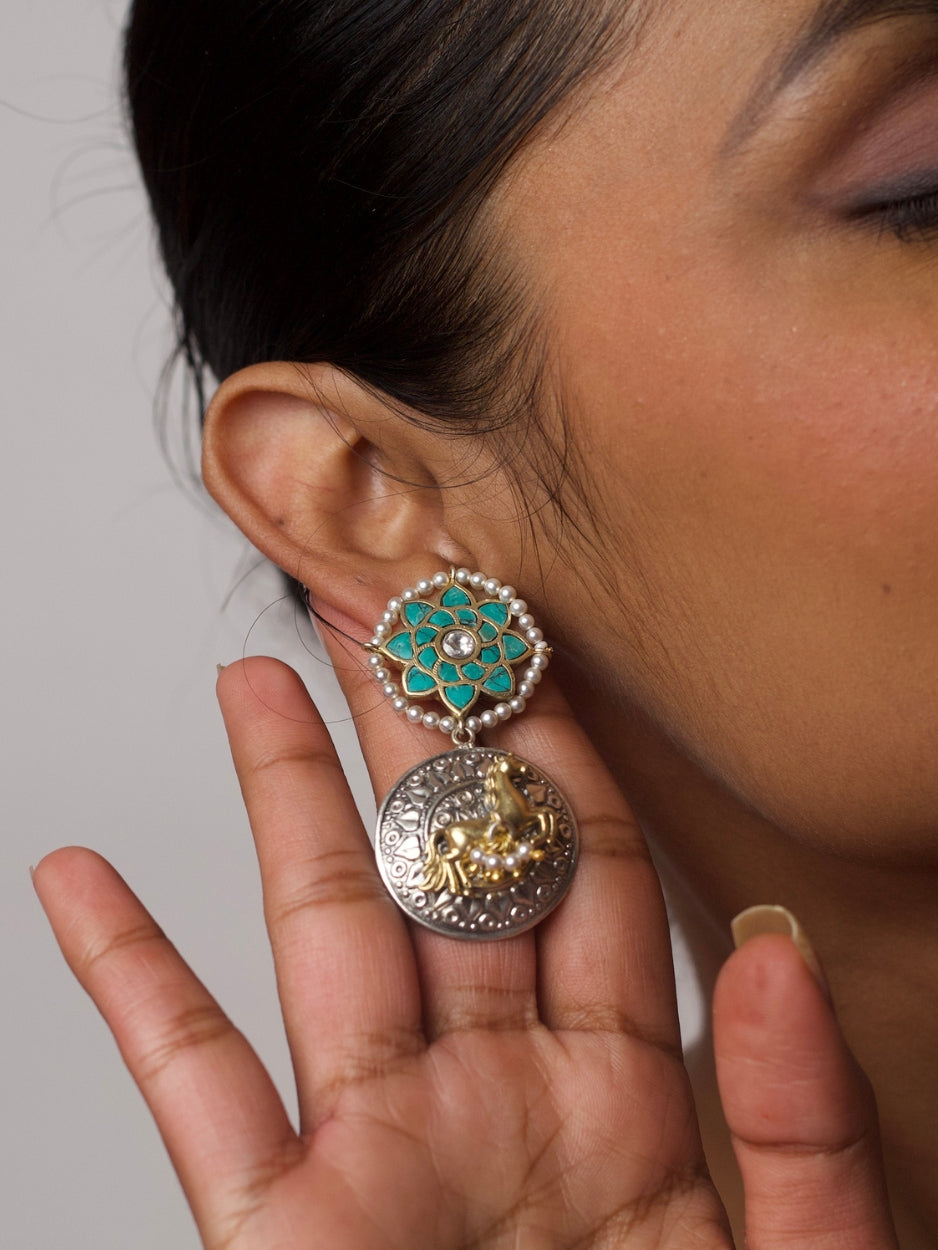Close-up of Turquoise Trotters Earrings — silver horse motif drop with turquoise enamel floral top and pearl accents, handcrafted in 92.5 silver