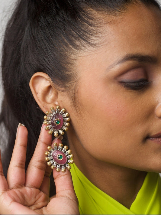 Close-up of Pink Kaju Barfi Studs in 92.5 silver featuring carved pink stone, golden and silver petal border, and green centre gemstone — mithai-inspired festive earrings