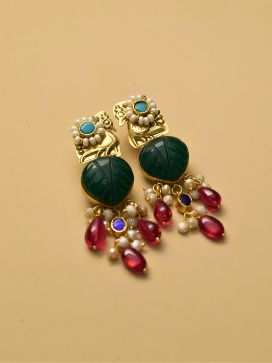 Gold polished peacock earrings with green carved center and pearl drops