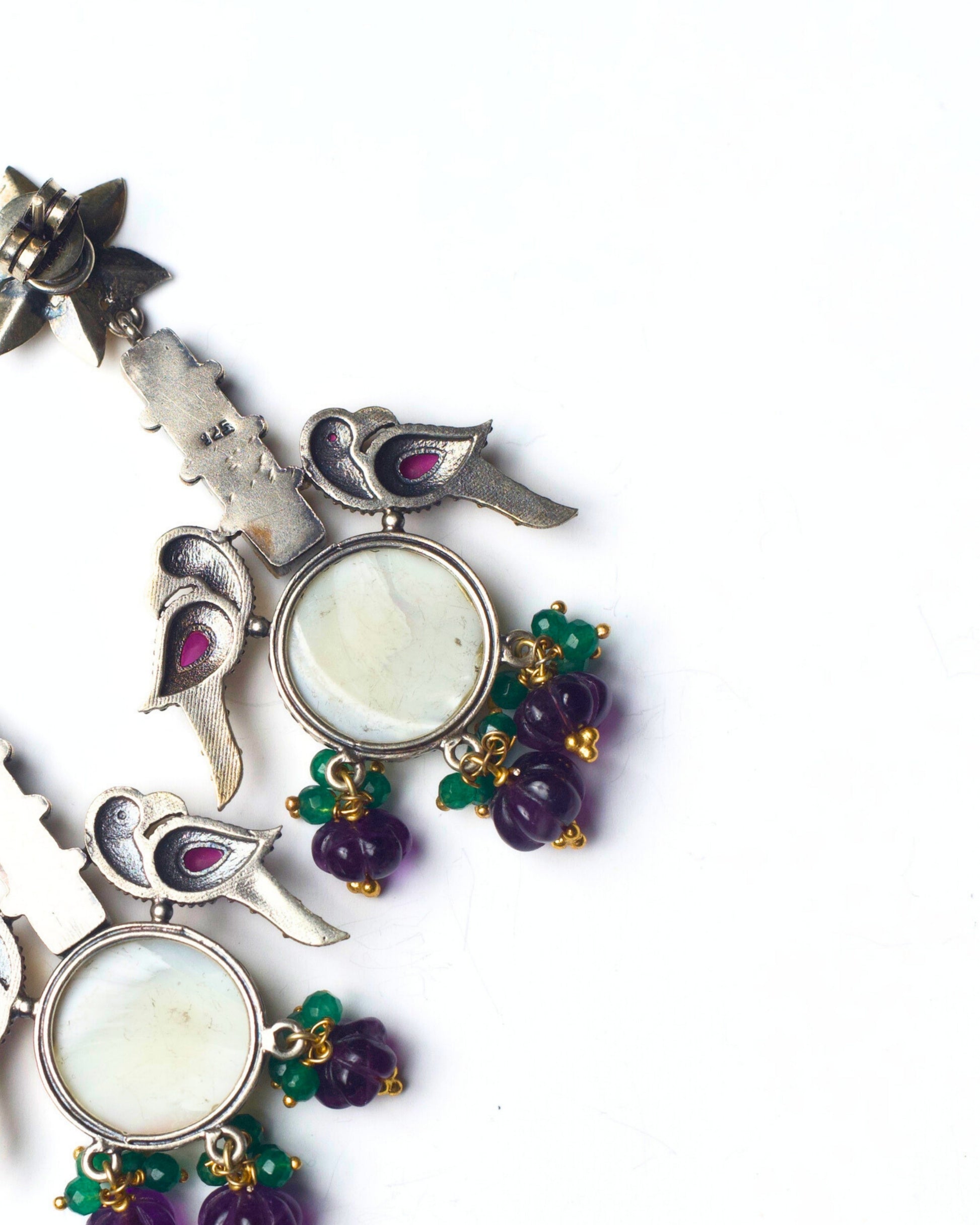 Back view of The House of Birds Earrings showing structured metal framework, secure stone settings, and balanced craftsmanship