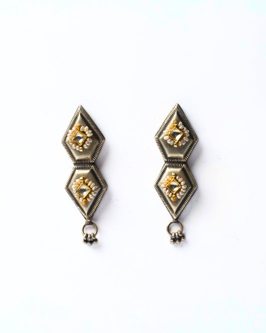Front view of Mirror Kite Earrings featuring stacked kite-shaped silver forms with central square mirror stones and fine pearl detailing.