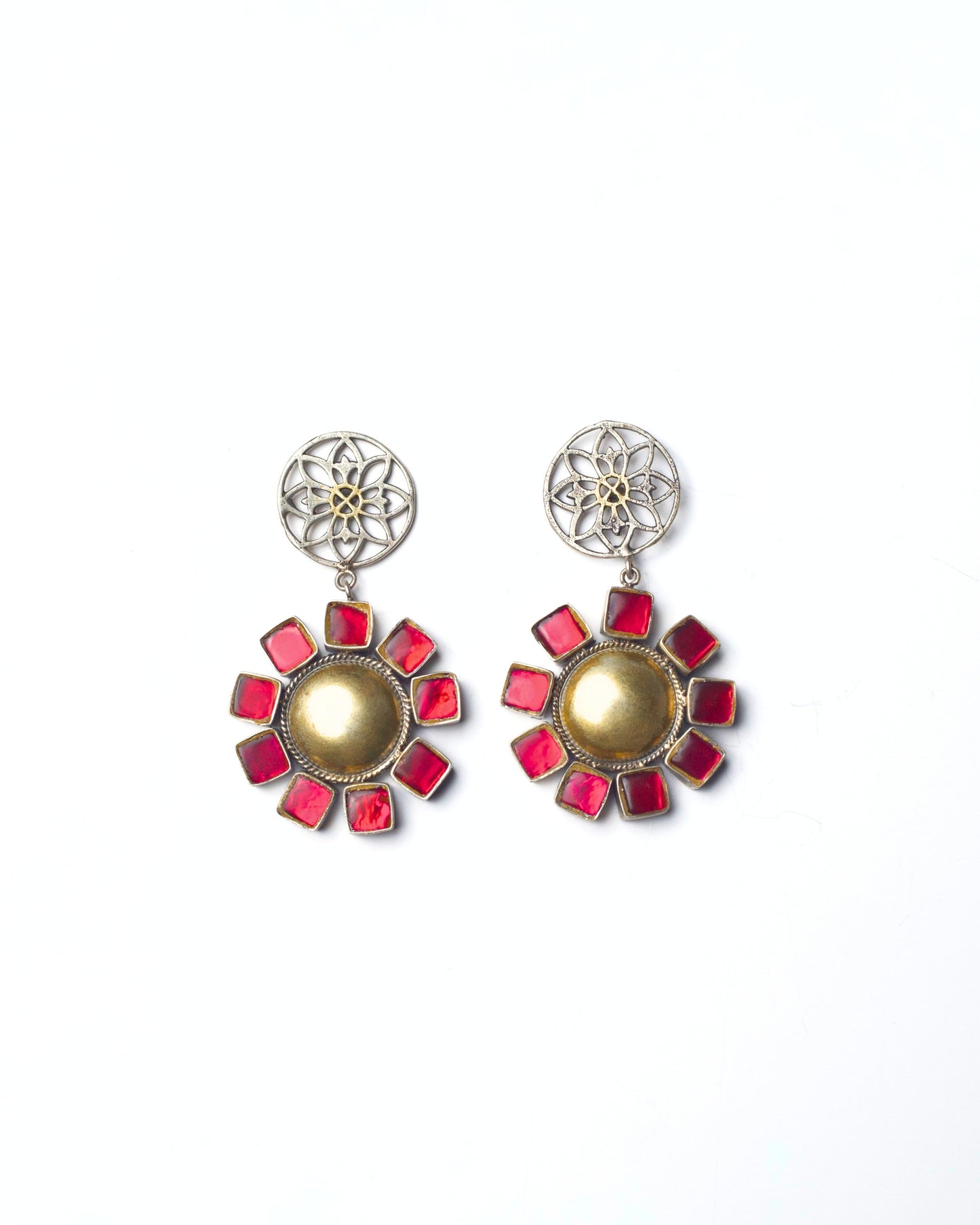 Front view of The Blush Halo Earrings featuring a circular gold-toned centre surrounded by pink square stones, suspended from a delicate silver floral stud.