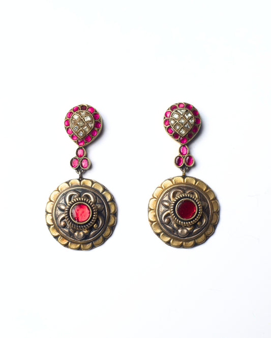 Front view of Pineapple Pink Earrings featuring a sculpted stud, scalloped circular medallion, and a vivid pink centre set in detailed silver.