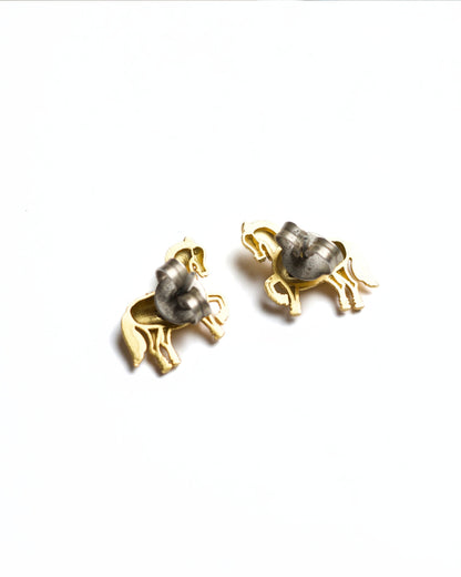 Small gold horse stud earrings with prancing leg and detailed saddle texture, polished finish, minimal white background.
