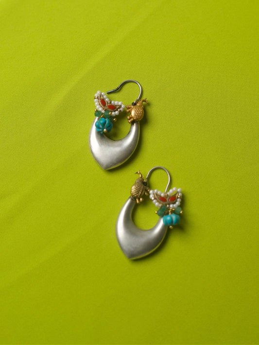Elongated 92.5 silver hoop earrings with turquoise feroza beads, golden elephant charms, and red enamel accents